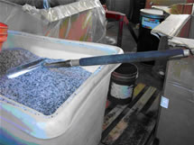 A bin of raw materials waiting to be mixed