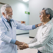 Doctor greeting patient who is authorized for treatment